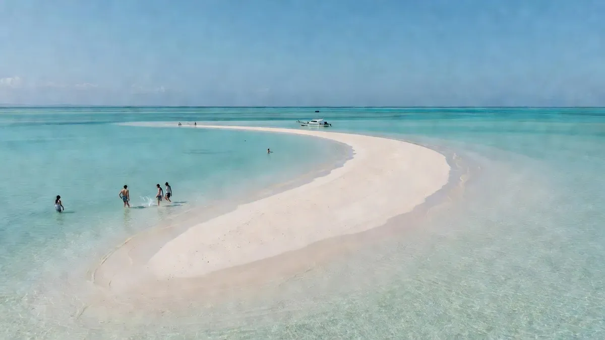 The vanishing Hamajima sandbar surrounded by turquoise water on an ishigaki snorkeling boat tour in Okinawa, Japan