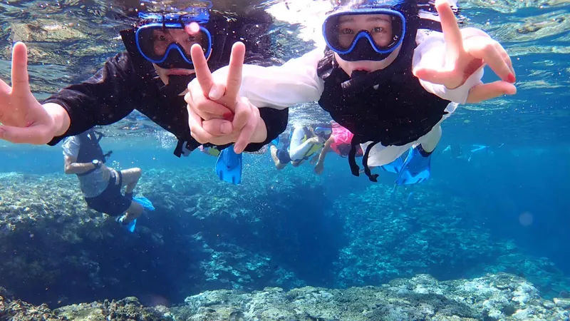Snorkelers at the Blue Cave before visiting Taketomi Island on an ishigaki snorkeling tour in Okinawa, Japan